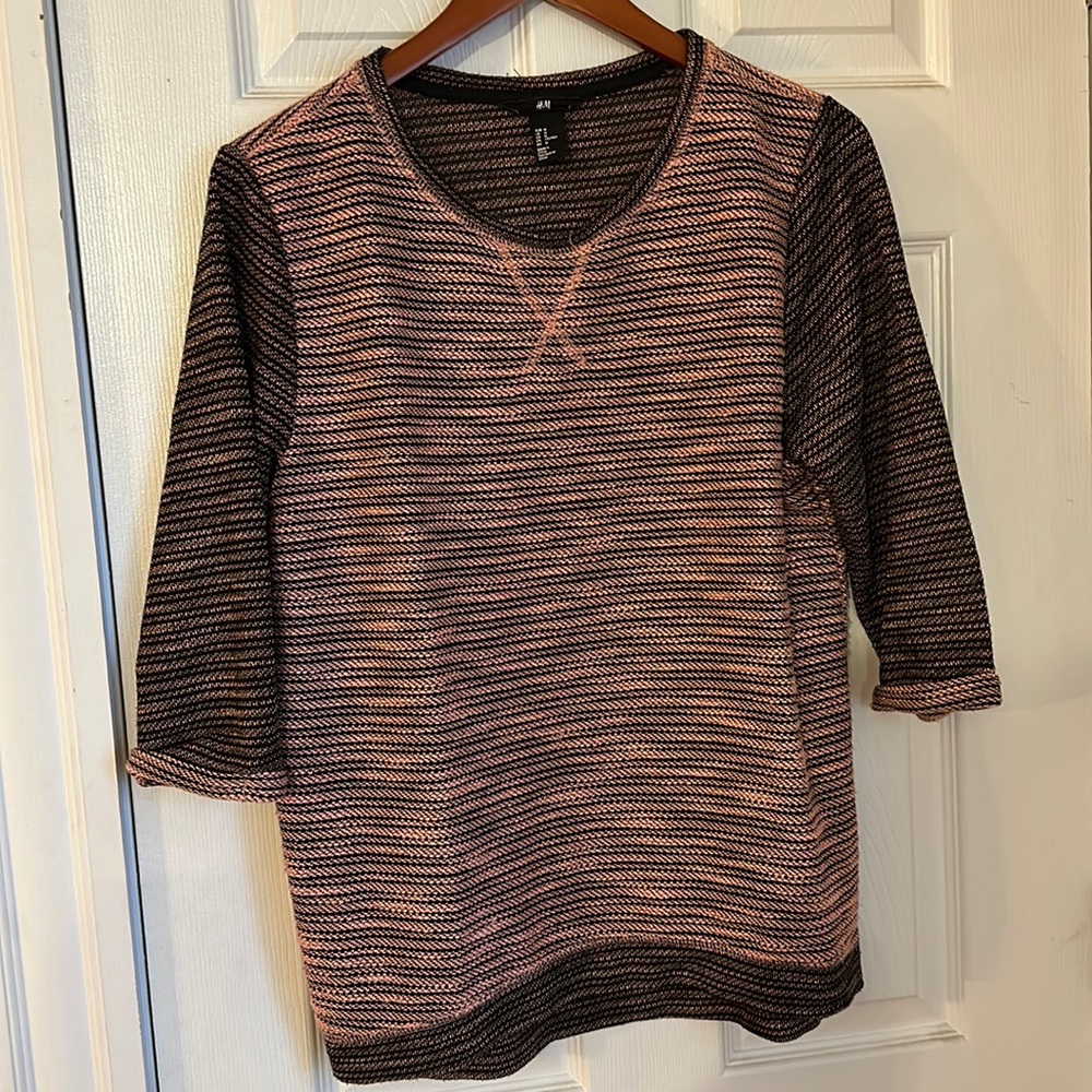 Quarter sleeve knit sweater.